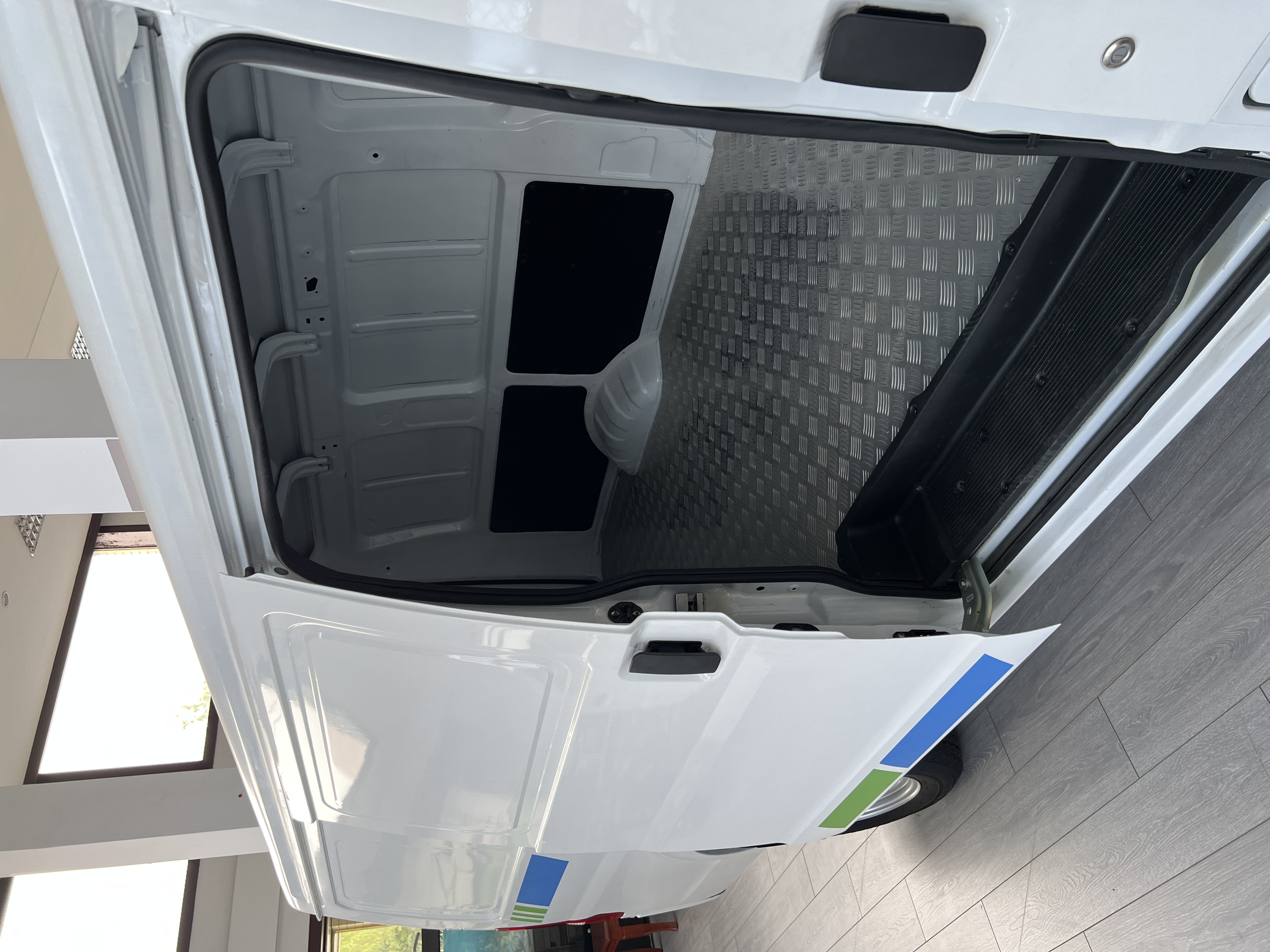 Real 5.1m cargo van sliding side door and empty cargo area